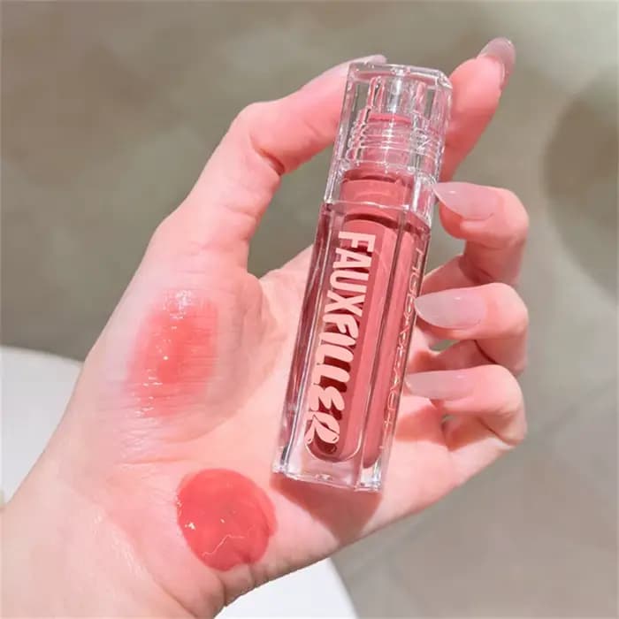 Huda Beauty Faux remplissage brillant Non collant
