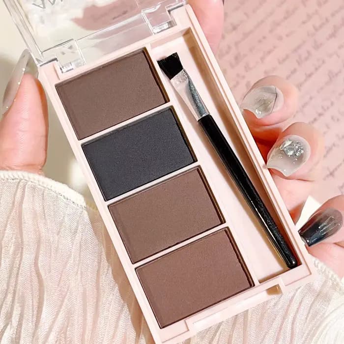 Un ensemble de plateaux de poudre à sourcils de 4 couleurs avec des pinceaux en tons gris et marron mat pour un rendu durable, un remplissage et un s