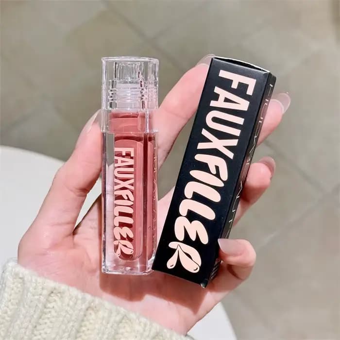 Huda Beauty Faux remplissage brillant Non collant