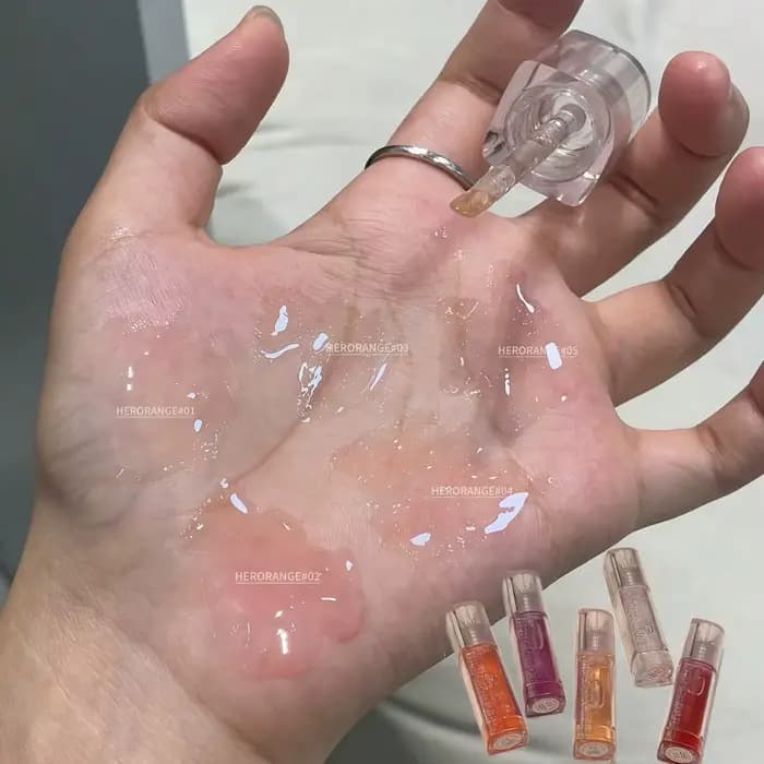 Huile à lèvres teintée scintillante Herorange
